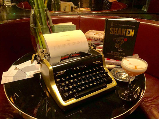 Fleming typewriter, cocktail and Shaken book